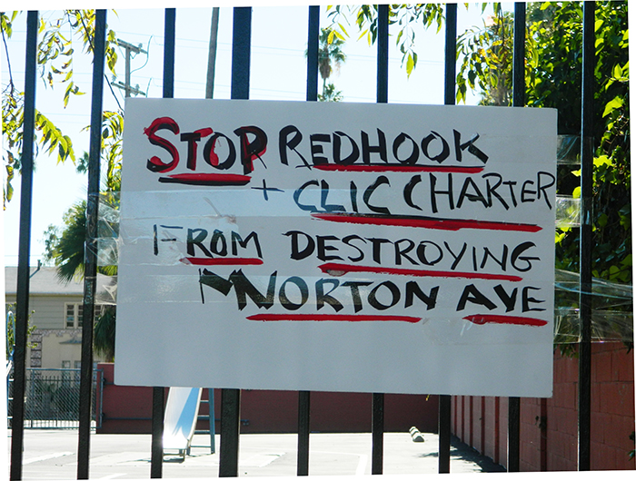 Neighbors in the West Adams District have posted this sign on the fence of a former preschool near Venice Boulevard and Norton Avenue in their efforts to prevent a charter school from opening on the site. Neighbors say a charter school would bring too much traffic to their residential neighborhood. (Photo courtesy of Fifth Avenue Times)