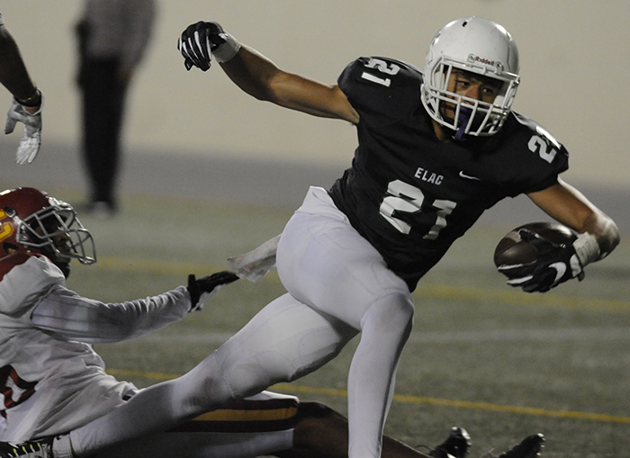 East Los Angeles College wide receiver Khamren Davenport reaches for the goal line to score on a 13-yard touchdown pass in the second quarter against Glendale. (Photo by Mario Villegas)