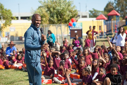 Los Angeles Clippers guard Chris Paul speaks to students at Barack Obama Charter Elementary School on Nov. 1. Paul, through his foundation and with the support of Shoes That Fit, presented each student at the school with a new pair of sneakers. (Courtesy photo)