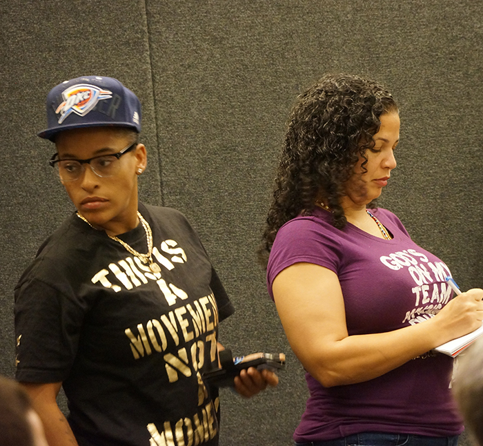 Jasmine Richards, left, and Melina Abdullah of Black Lives Matter wait for their turns to speak at the Los Angeles Police Commission meeting Aug. 18. The meeting was recessed briefly after community activists became disorderly.
(Photo by Gary McCarthy)